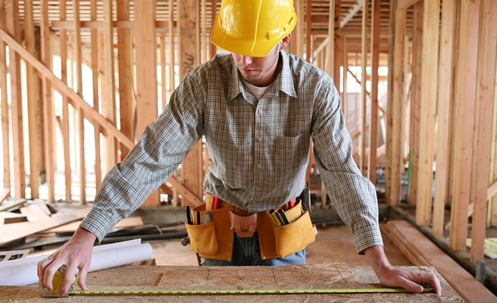 Man measuring on a table
